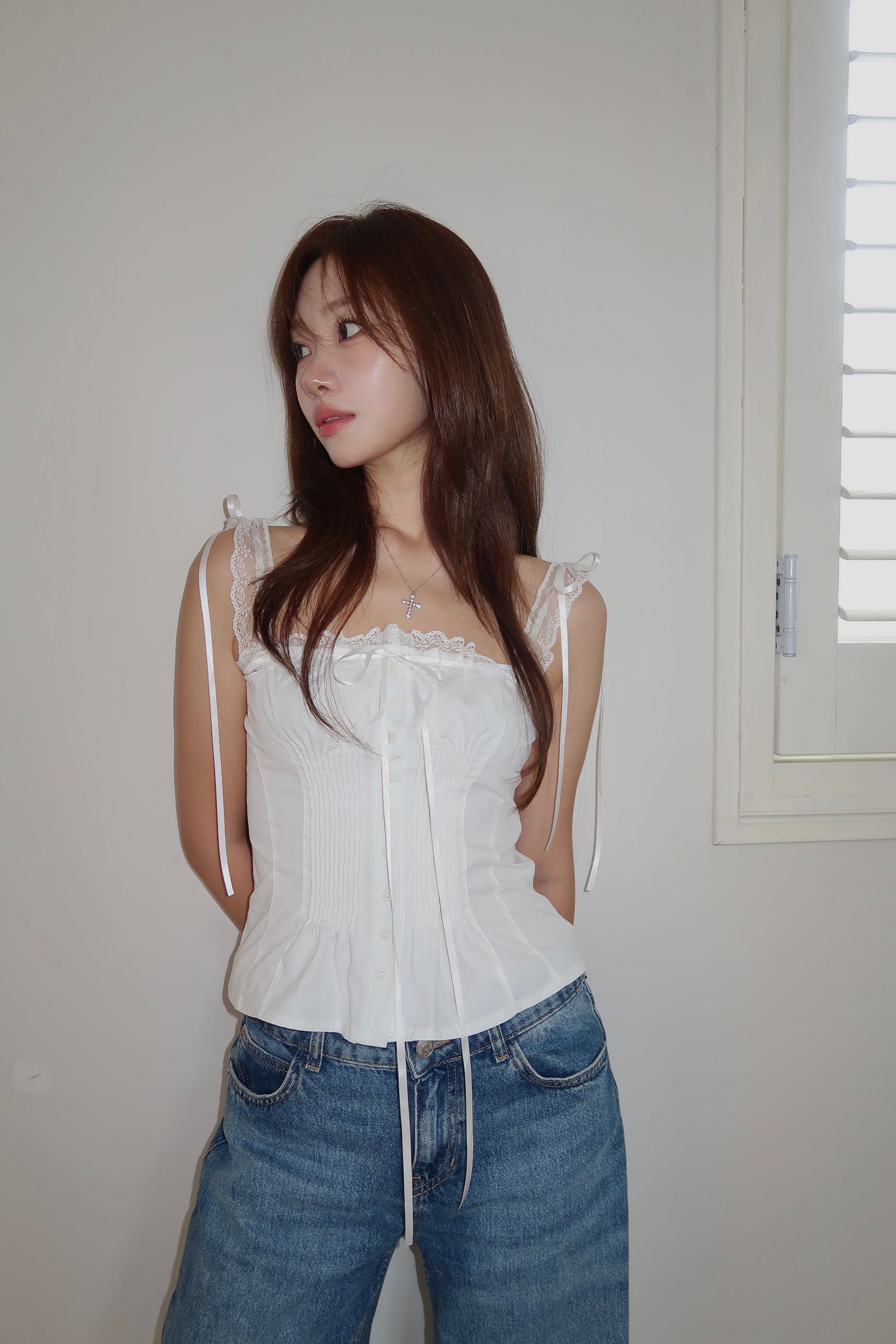 The Triple Ribbon Top worn full length with jeans, satin ties at both shoulders